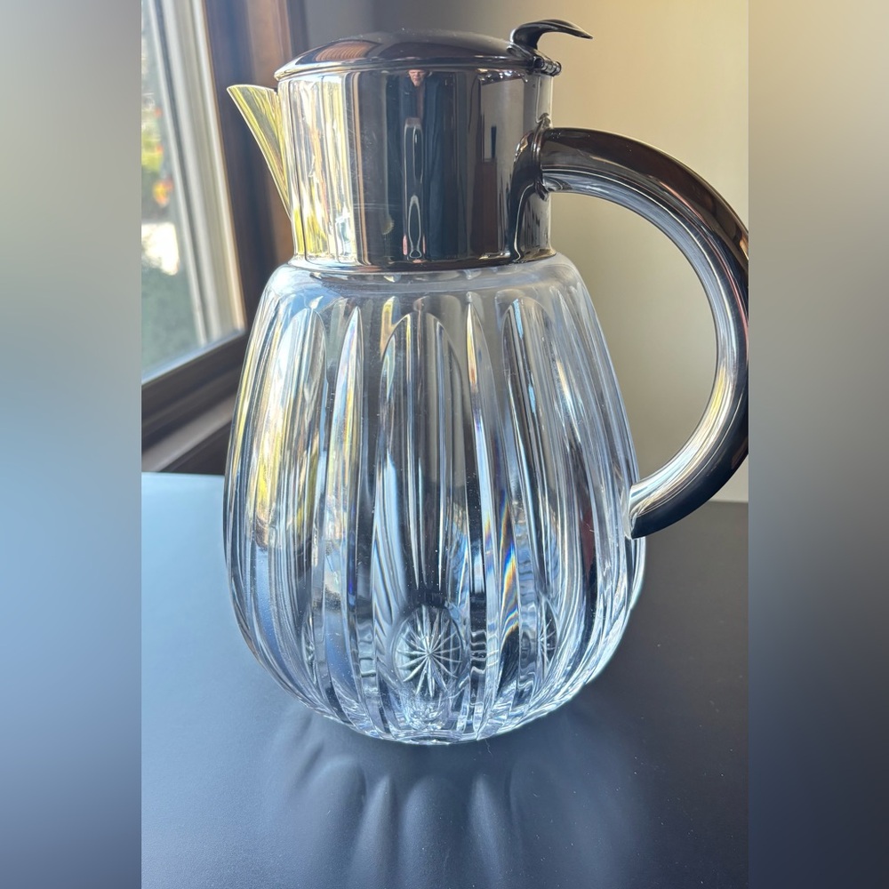 Cut crystal water pitcher with silver plate top and handle
